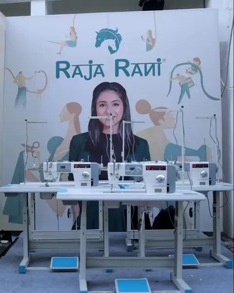 Sewing machines on the Raja Rani Fashion Show 2025 stage in Surat
